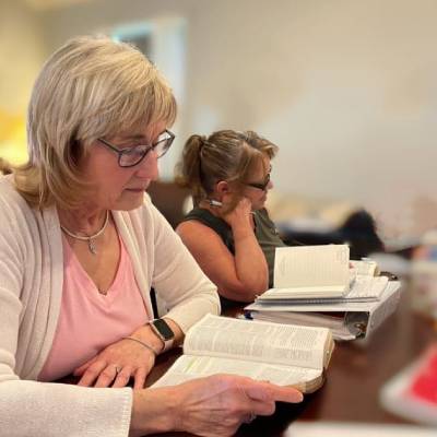 women reading the Bible as part of christian recovery program