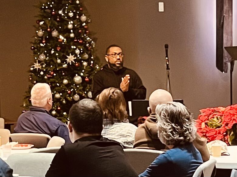 man speaking at church